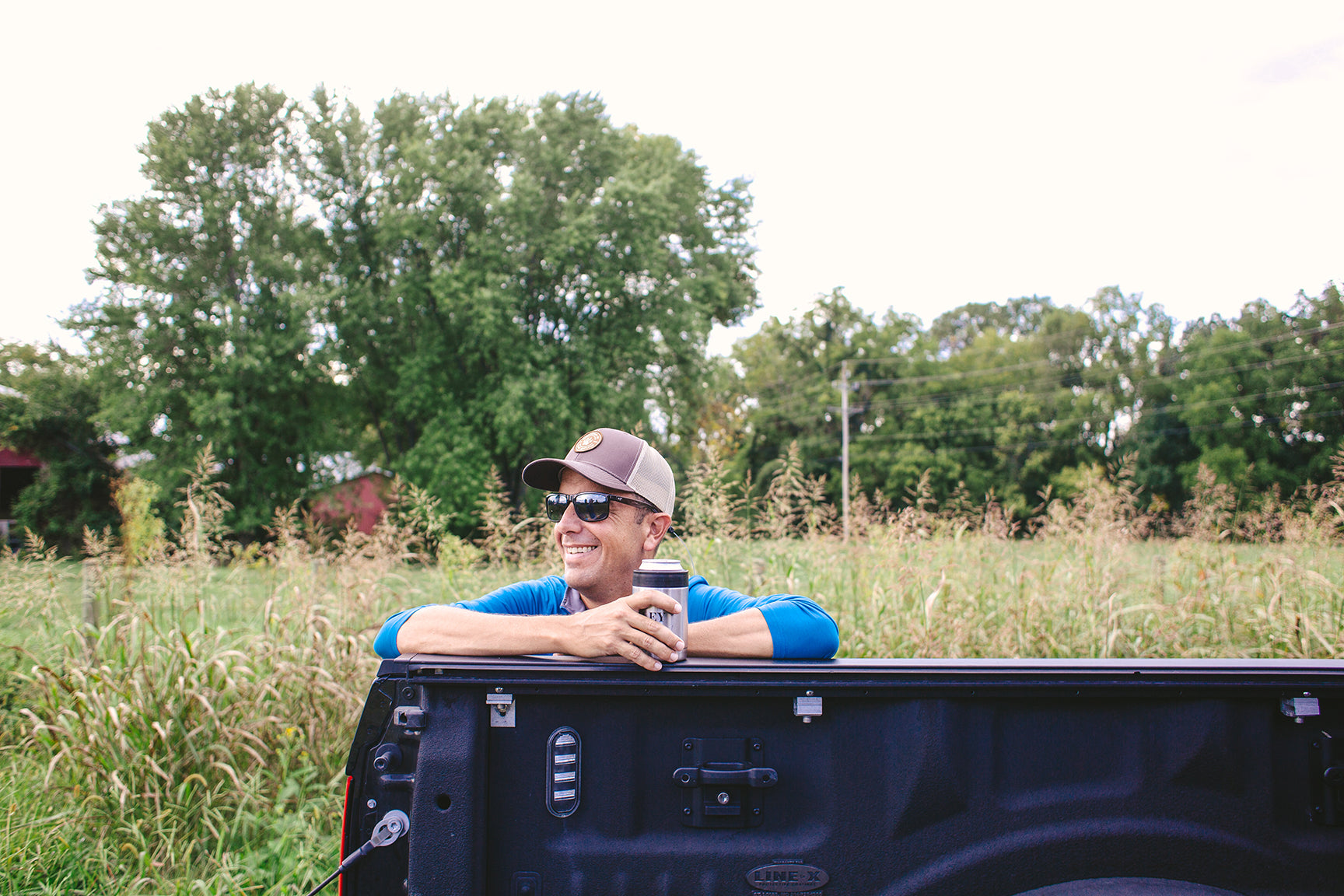 In a field getting ready to go fishing.